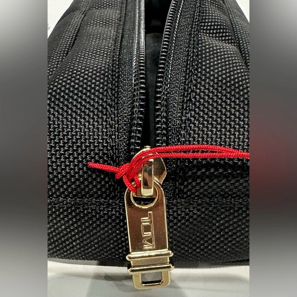 NWT Tumi Travel Accessory Zipper Cord Pouch Bag Black Gold Tone Hardware
